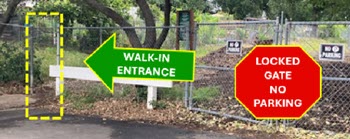 Image showing the walk-in entrance to the left of the locked gate. There is no parking in front of the gate.