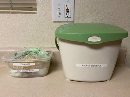 A kitchen pail used to collect vegetable, fruit and other food scraps used in backyard composting and separates meat scraps, bones and dairy products into a BPI-certified compostable bag for the Organics cart